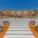 A patio with chairs and tables at Naya Beach Bar & Restaurant in Faliraki, Greece